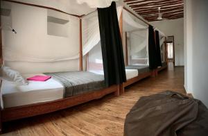 Katil atau katil-katil dalam bilik di Stone Town House