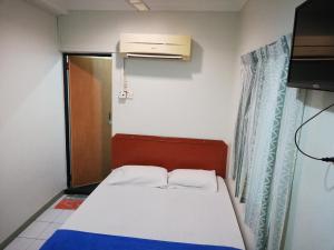 Sri Gate Hotel客房内的一张或多张床位