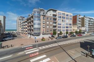 a view of a city with buildings and a street at Appartement Ter Zee in De Panne