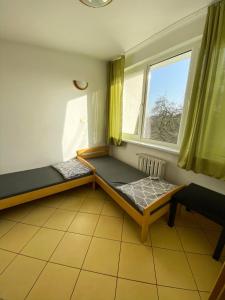 Postel nebo postele na pokoji v ubytování Ośrodek Wczasowy HELIOS