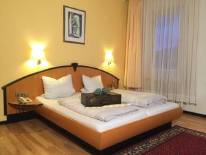 Postel nebo postele na pokoji v ubytování Hotel Kull von Schmidsfelden