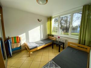 Postel nebo postele na pokoji v ubytování Ośrodek Wczasowy HELIOS