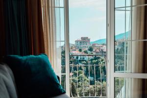 a window with a view of a city at Muskatel Boutique Hotel in Gurzuf