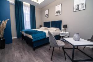 Kama o mga kama sa kuwarto sa Apartments Azzurro Sarajevo