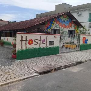 a building with a mural on the side of it at Hostel Cidade das Flores 2 in Joinville