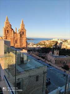 a view of a city from the roof of a building at Lure Hotel & Spa - Adults Only in Mellieħa
