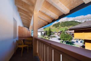 a balcony with a view of a mountain at HOTEL B&B MARILENA in Arabba