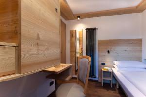 A bed or beds in a room at HOTEL B&B MARILENA