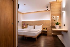 A bed or beds in a room at HOTEL B&B MARILENA