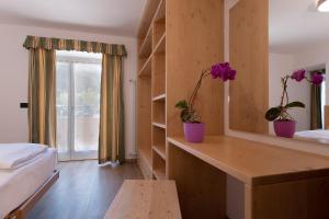A bed or beds in a room at HOTEL B&B MARILENA