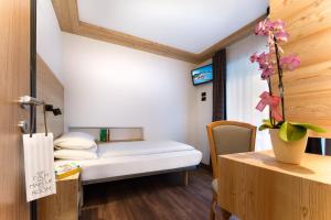 A bed or beds in a room at HOTEL B&B MARILENA