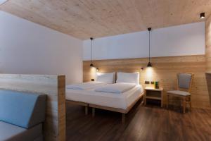 A bed or beds in a room at HOTEL B&B MARILENA