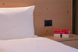A bed or beds in a room at HOTEL B&B MARILENA