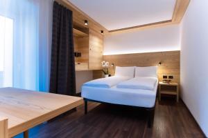 A bed or beds in a room at HOTEL B&B MARILENA