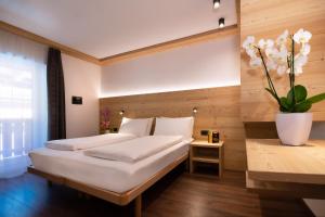 A bed or beds in a room at HOTEL B&B MARILENA
