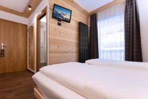 A bed or beds in a room at HOTEL B&B MARILENA