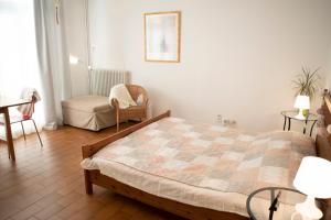 En eller flere senger på et rom på Casa del Sole