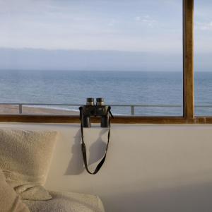 a view of the ocean from a room with a window at Coastguard Lookout by Bloom Stays in Littlestone-on-Sea