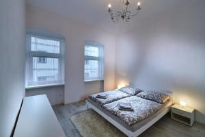 Posteľ alebo postele v izbe v ubytovaní Apartmán BB centrum