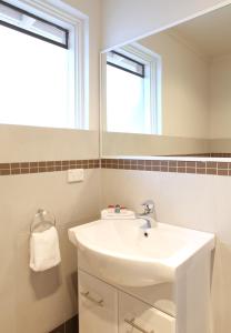 a bathroom with a sink and a mirror at Rose & Crown Hotel in Perth