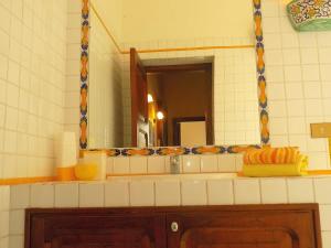 a bathroom with a sink and a mirror at casa Calla in Maiori