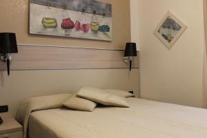 Postel nebo postele na pokoji v ubytování Coccodrillo Hotel & Apartments
