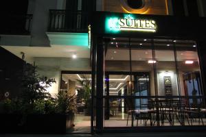 a restaurant with a sign on the front of it at night at Şişli Luxury K Suites Hotel in Istanbul
