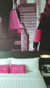 Postel nebo postele na pokoji v ubytování favehotel Pluit Junction