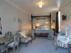 Säng eller sängar i ett rum på Cotswold Cottage Bed and Breakfast