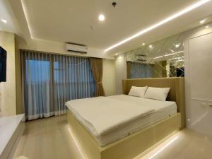 TV/Unterhaltungsangebot in der Unterkunft Platinum 1010 Studio Tera Apartemen Bandung City View