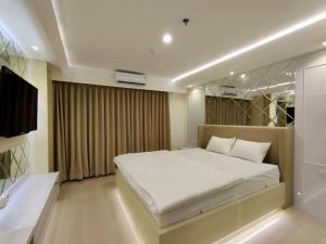 Ein Bett oder Betten in einem Zimmer der Unterkunft Platinum 1010 Studio Tera Apartemen Bandung City View