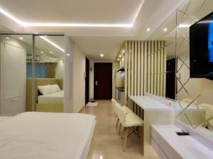 Ein Bett oder Betten in einem Zimmer der Unterkunft Platinum 1010 Studio Tera Apartemen Bandung City View