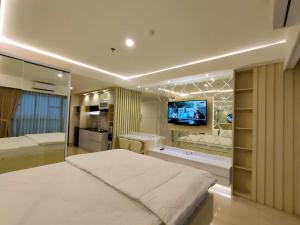 Ein Bett oder Betten in einem Zimmer der Unterkunft Platinum 1010 Studio Tera Apartemen Bandung City View