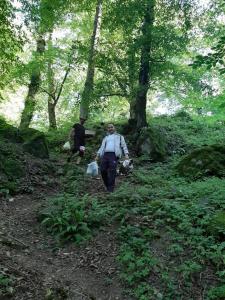 two people walking down a trail in the woods at Buta Hotel Lerik in Lerik
