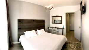 Postel nebo postele na pokoji v ubytování Hotel Anthousa