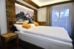 Postel nebo postele na pokoji v ubytování Hotel Elite