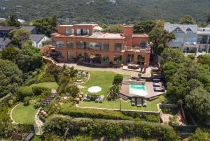 an aerial view of a house with a swimming pool at Xanadu Guest Villa in Wilderness