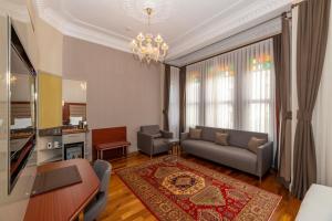 a living room with a couch and a table at Blue Gilroy Hotel in Istanbul