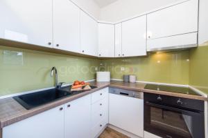 Kuchyň nebo kuchyňský kout v ubytování City Central Apartments Dolore