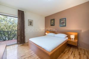 Postel nebo postele na pokoji v ubytování City Central Apartments Dolore