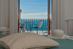 Cama ou camas em um quarto em Hotel Il Gabbiano