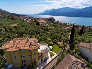 an aerial view of a house and a lake at La Pervinca Apartments in Malcesine