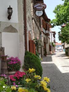 a street with flowers on the side of a building at Demirkapi Konak Hotel in Safranbolu