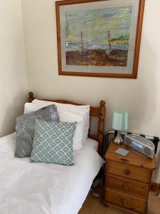 A bed or beds in a room at The Peels B&B 