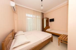 Voodi või voodid majutusasutuse Guesthouse Gio toas