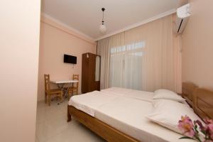 Postel nebo postele na pokoji v ubytování Guesthouse Gio