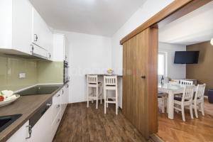 Kuchyň nebo kuchyňský kout v ubytování City Central Apartments Dolore