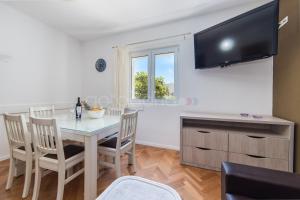 TV a/nebo společenská místnost v ubytování City Central Apartments Dolore