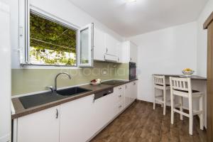 Kuchyň nebo kuchyňský kout v ubytování City Central Apartments Dolore
