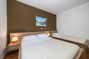 Postel nebo postele na pokoji v ubytování City Central Apartments Dolore